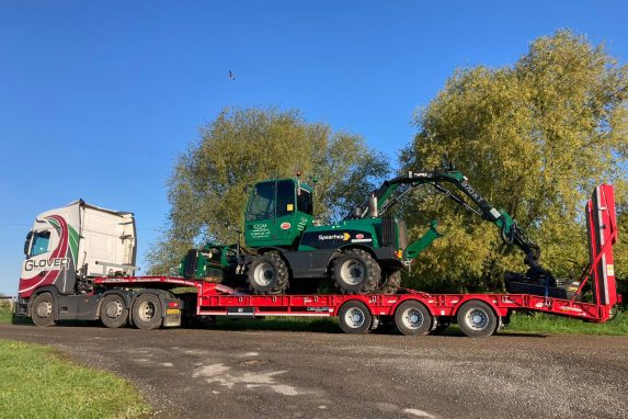 Glover lorry transporting CGM small digger to the site