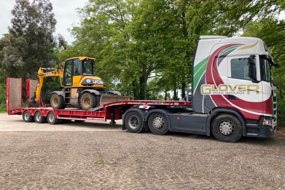 Glover lorry transporting JCB small digger