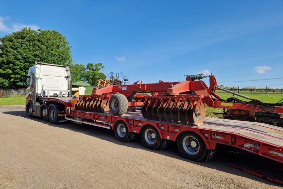 Glover lorry transporting tractor harvesting equipment