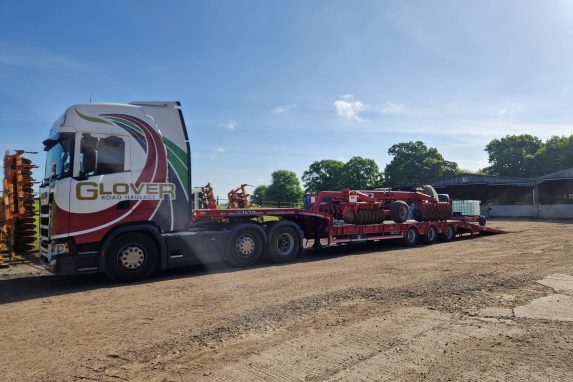 Glover red and white lorry parked by the side